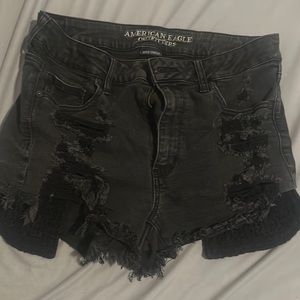 Distress black jean shorts. American Eagle.Floral lace exposed pockets. Stretchy